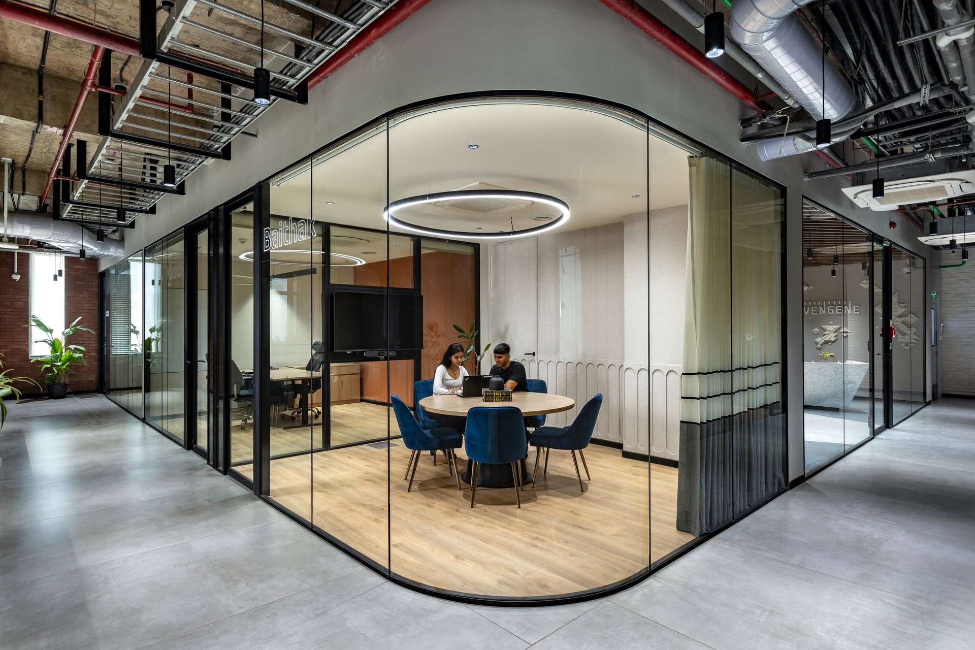 Baithak, a curved-corner discussion room that counters the orthogonal grid around it