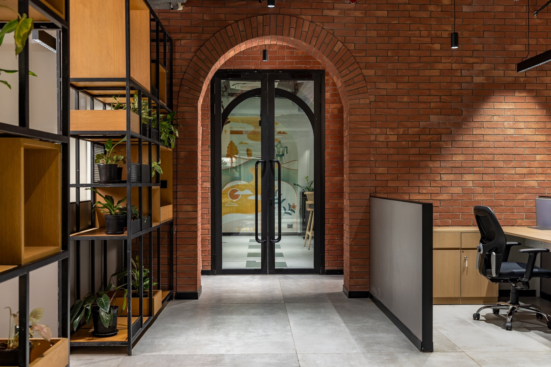 The threshold to the cafeteria: a red-brick arch frames the shift in mood from work to hospitality