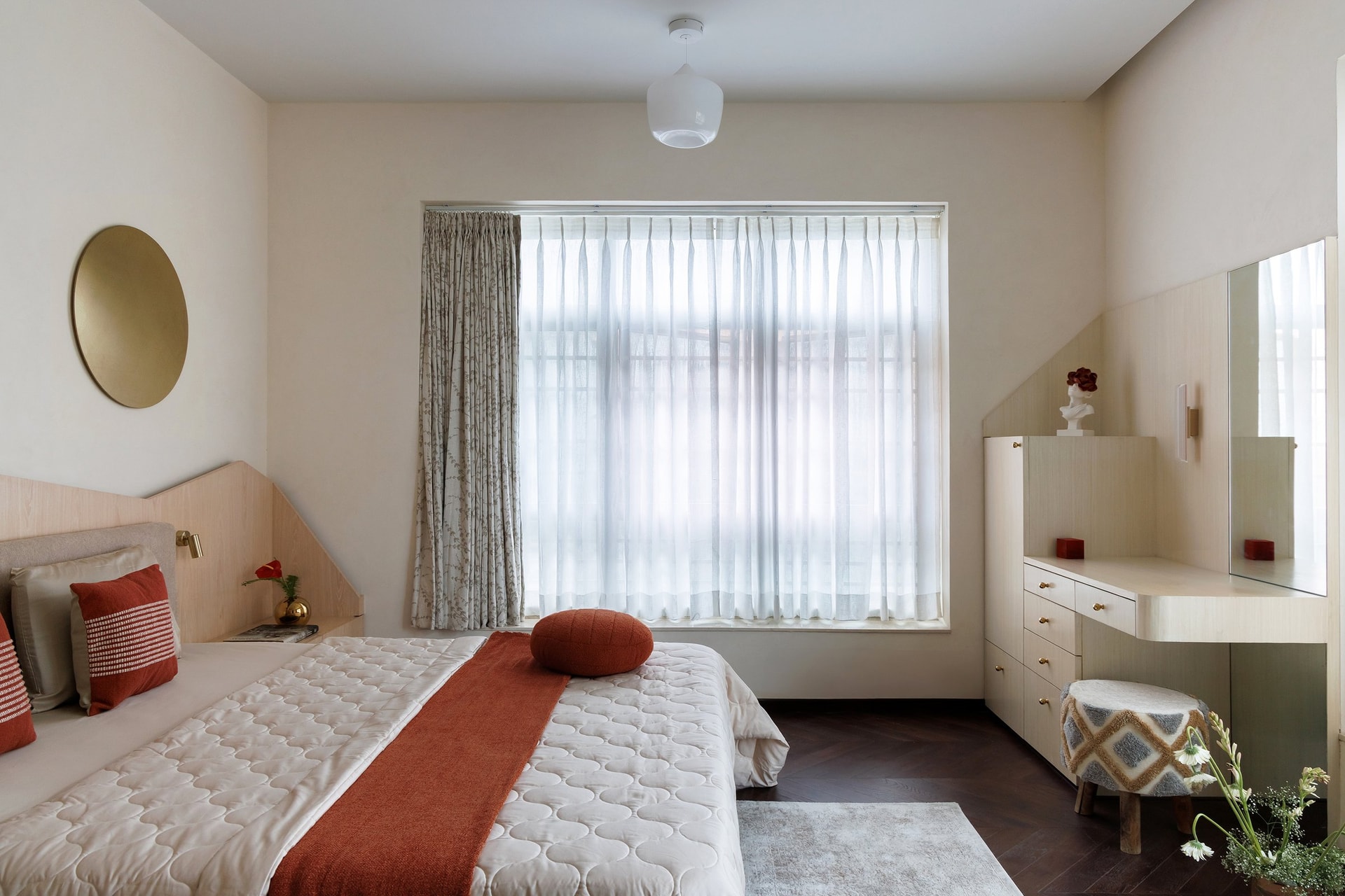 The second bedroom, organised around a generous window and a herringbone parquet floor in dark walnut
