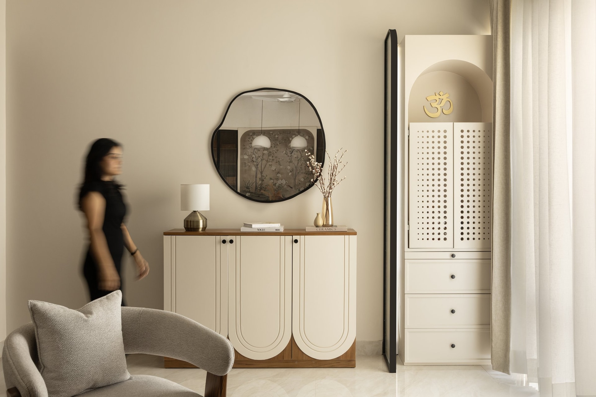 The processional from the entry, where console, mirror and prayer cabinet sit in quiet sequence