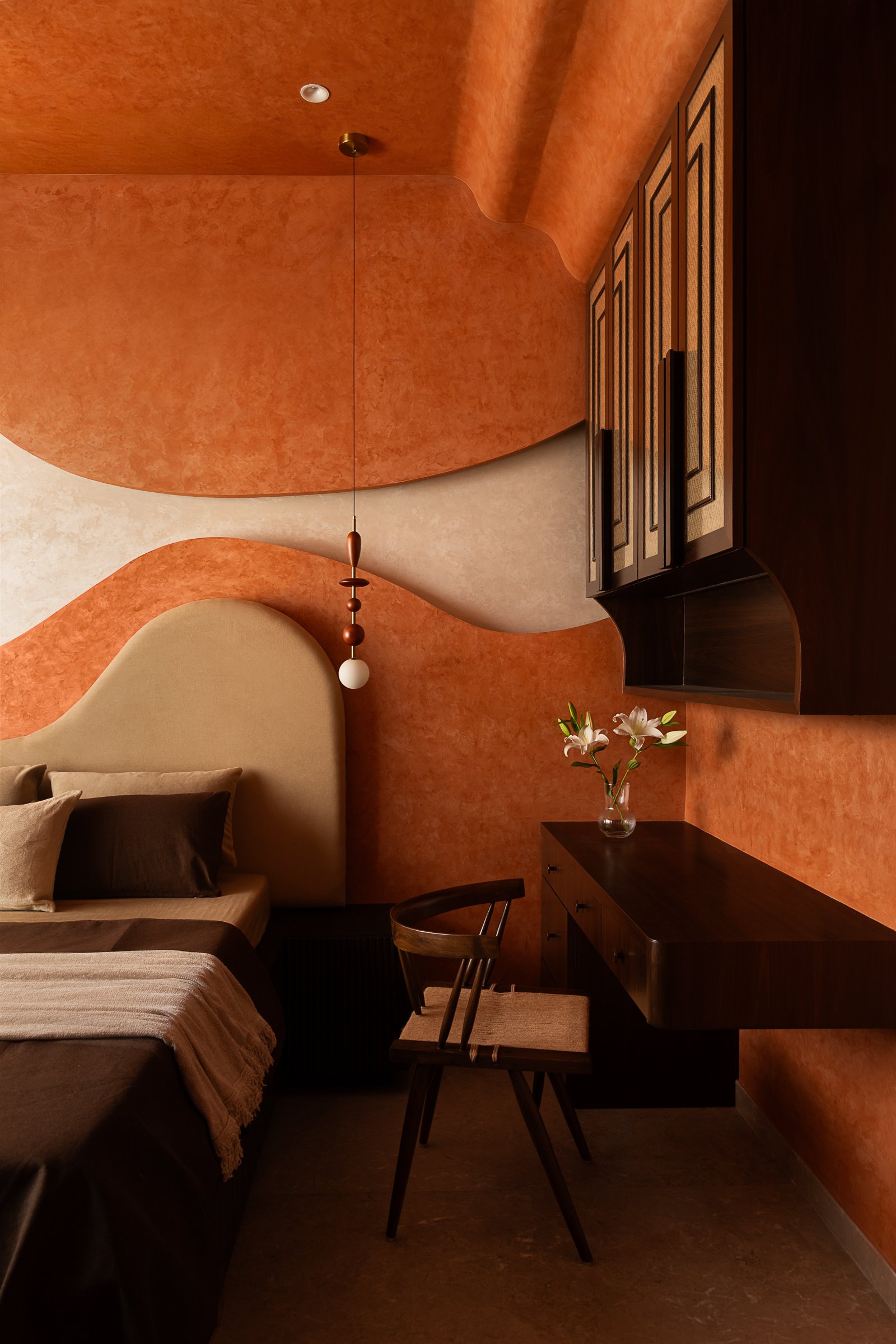An interior moment from Studio Homzstead, where warm materials, textured surfaces, and ambient lighting build atmosphere rather than spectacle