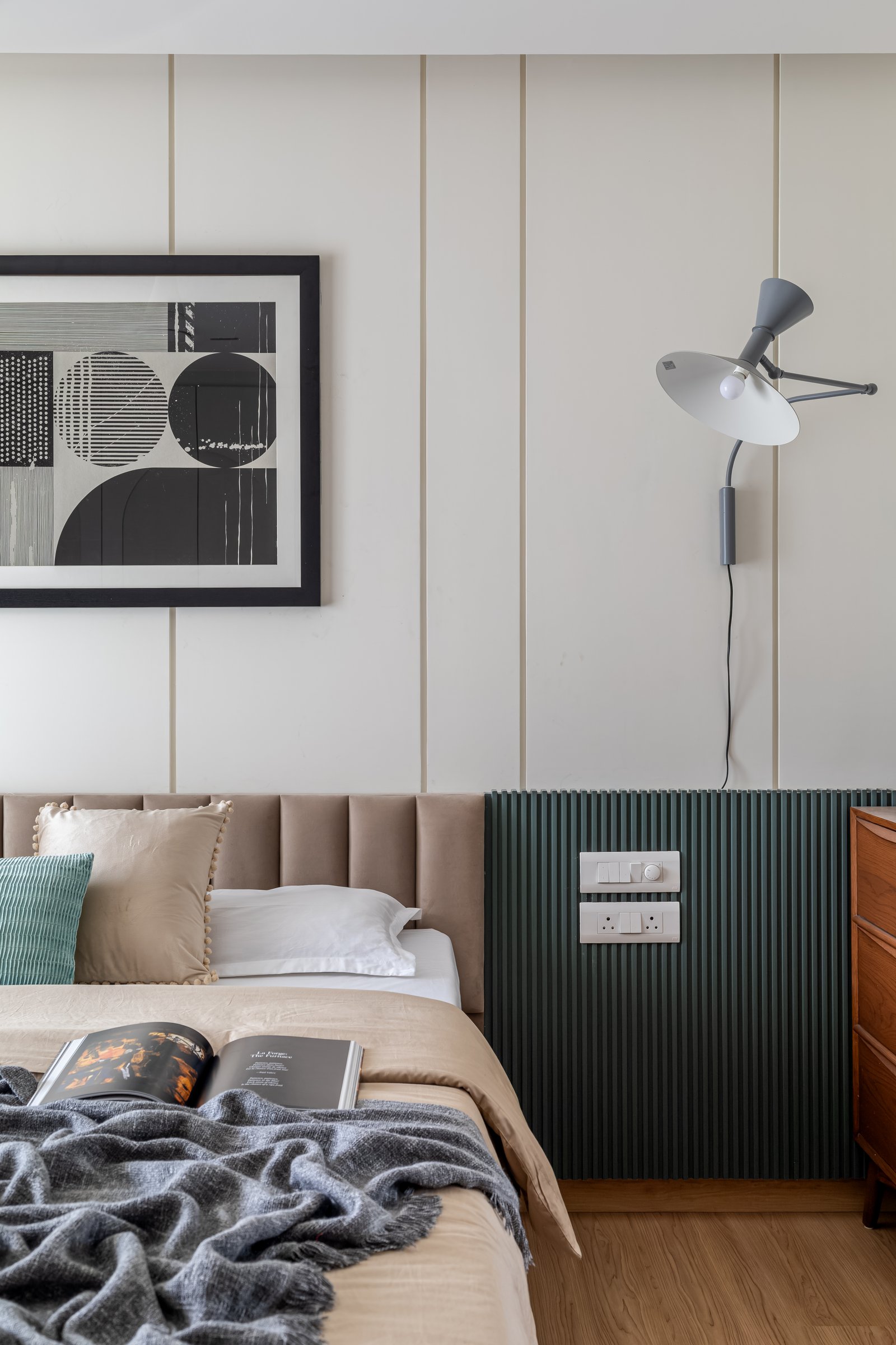A closer view of the headboard wall, where the brass reveals catch light only on inspection