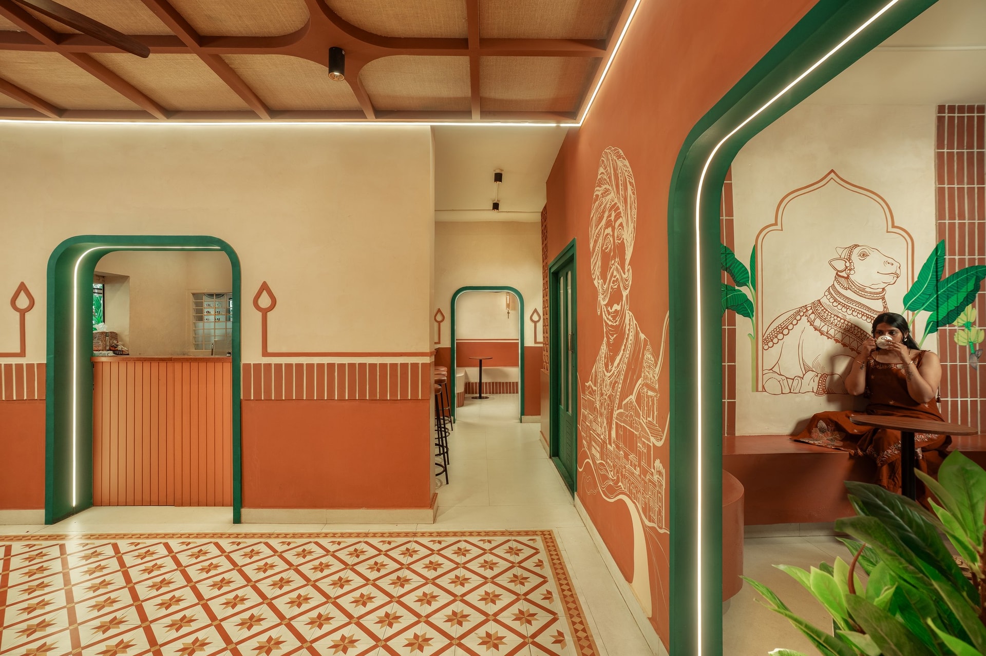 A side alcove with the Nandi mural framed within a painted shrine arch