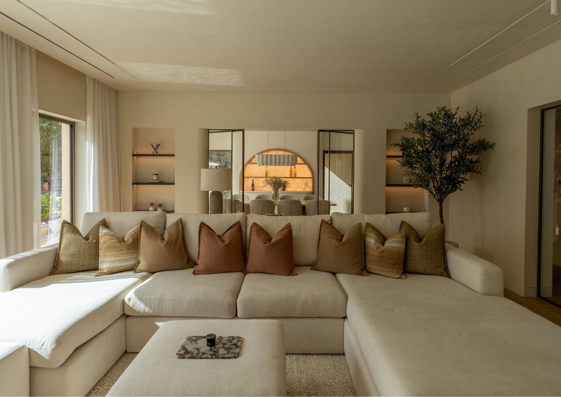 A study in spatial flow: internal glazing and a continuous material palette dissolve the boundaries between rooms in the founding villa renovation