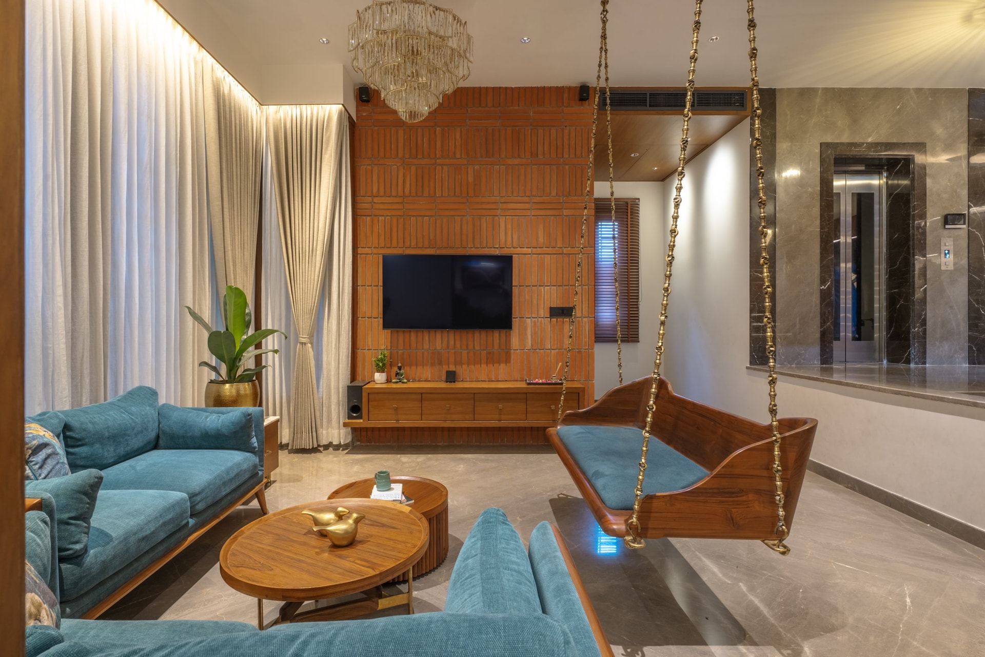 The living room media wall, where terracotta brick is set in rhythmic vertical and horizontal courses behind the television