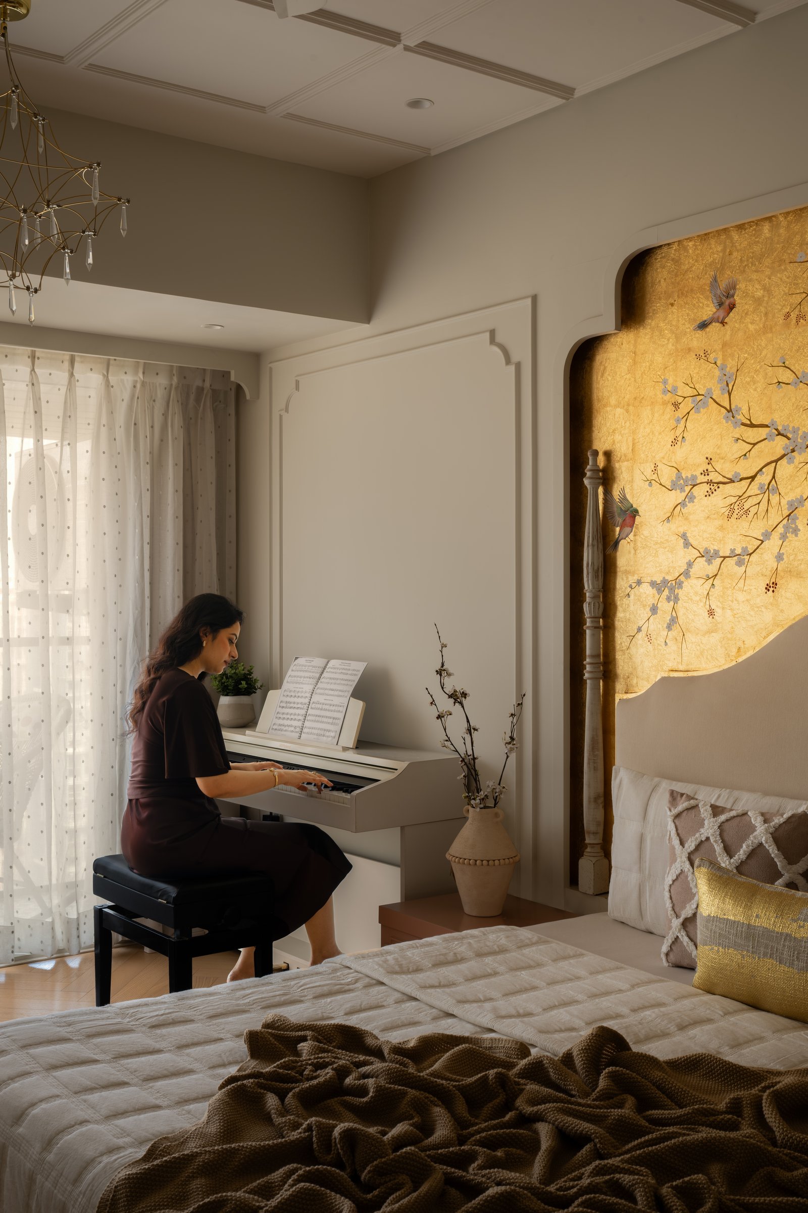 The bedroom doubles as a private practice space, the mural holding its own against everyday use