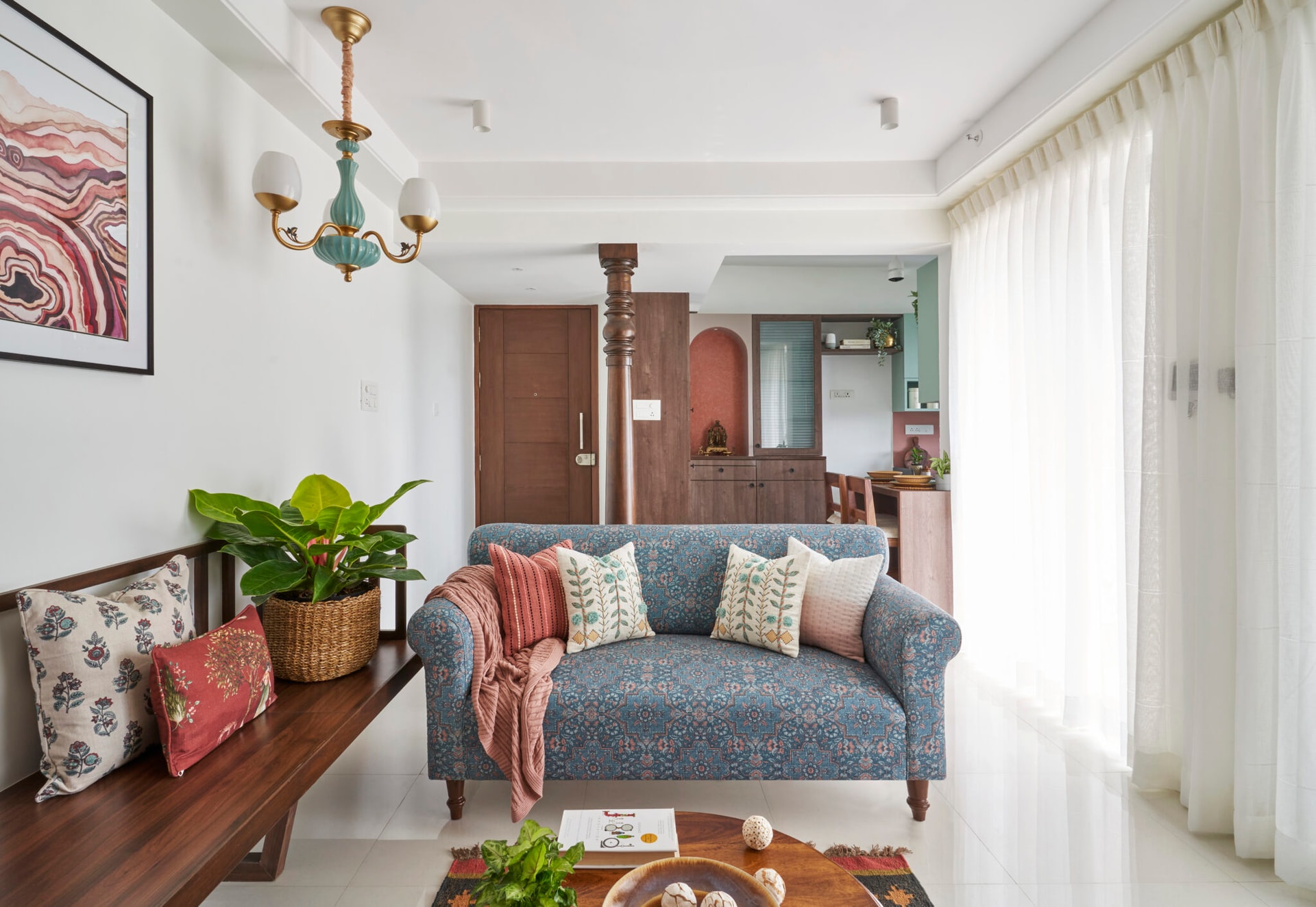 A hint of traditional elements with an earthy palette for this 730 Sqft Pune apartment, designed by INI Studio — interior design by INI Design Studio in Pune