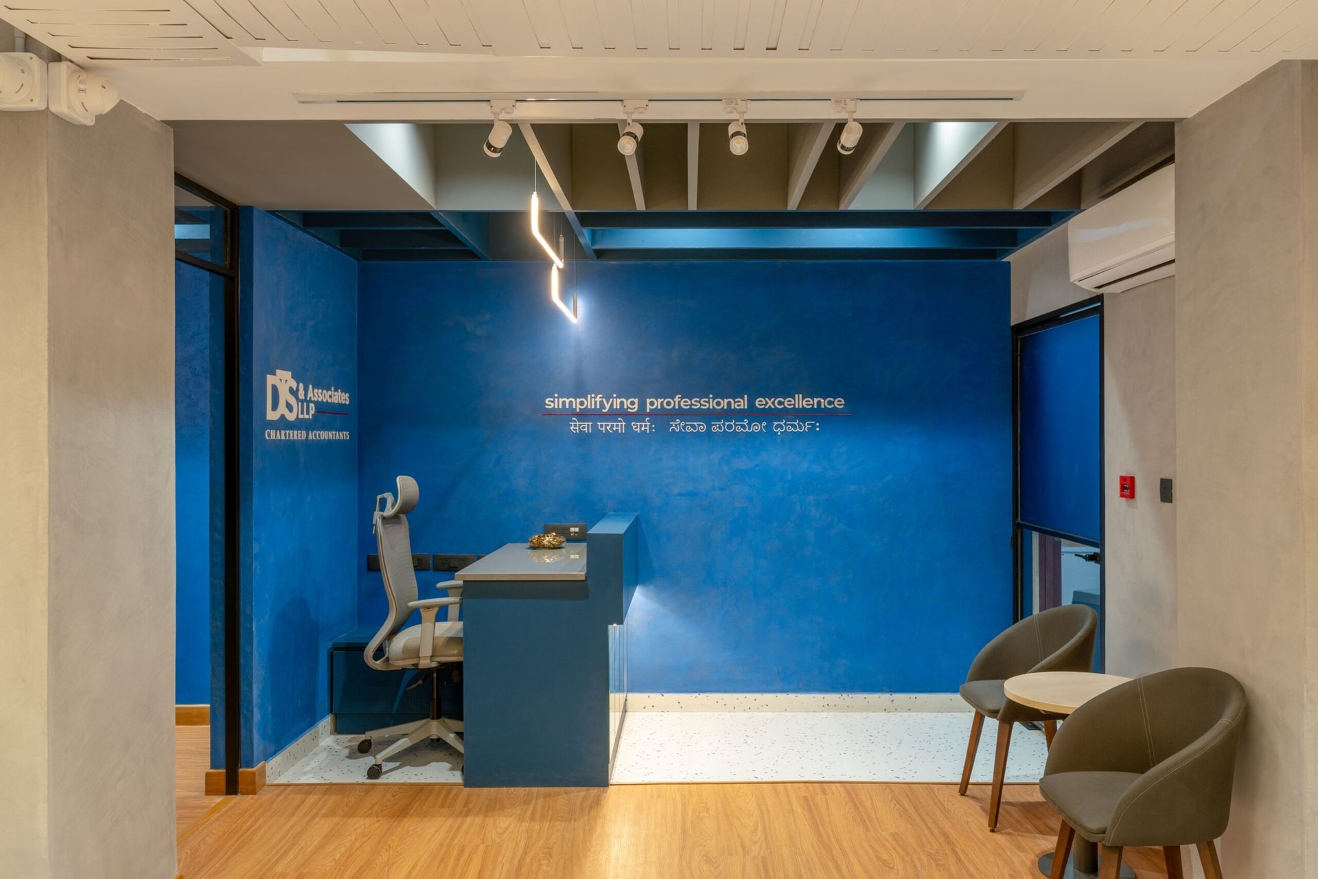Seen straight on, the foyer's discipline with colour, indigo as absorbent backdrop, becomes the room's quiet thesis