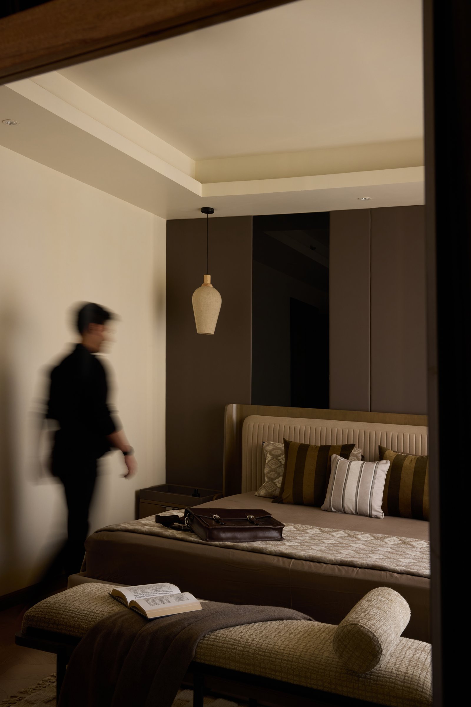 A second view through the doorway, the bedroom staged for living rather than for photography