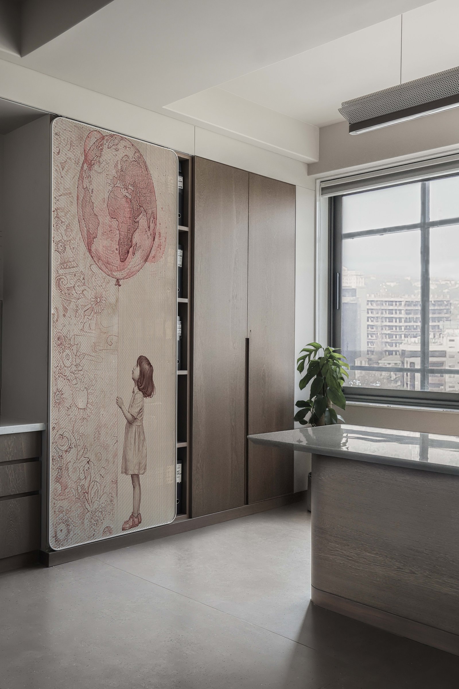 A pantry-adjacent corner where a pinboard illustration slides in front of a dark-stained storage wall