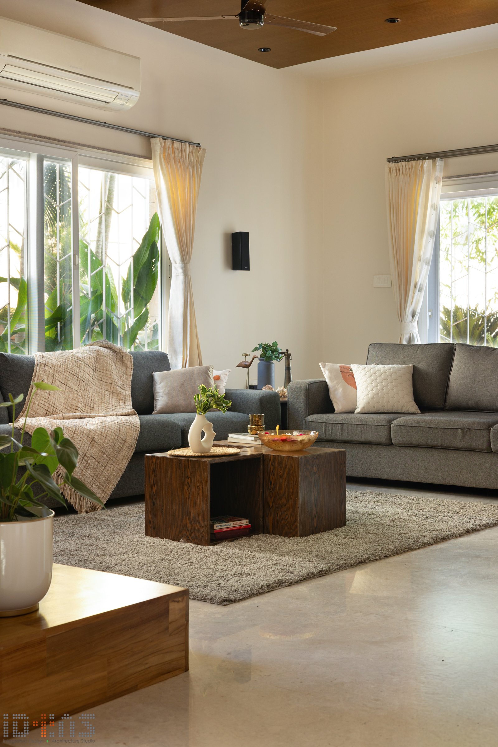 The seating arrangement, restrained to the point of austerity, lets filtered light do the decorative work
