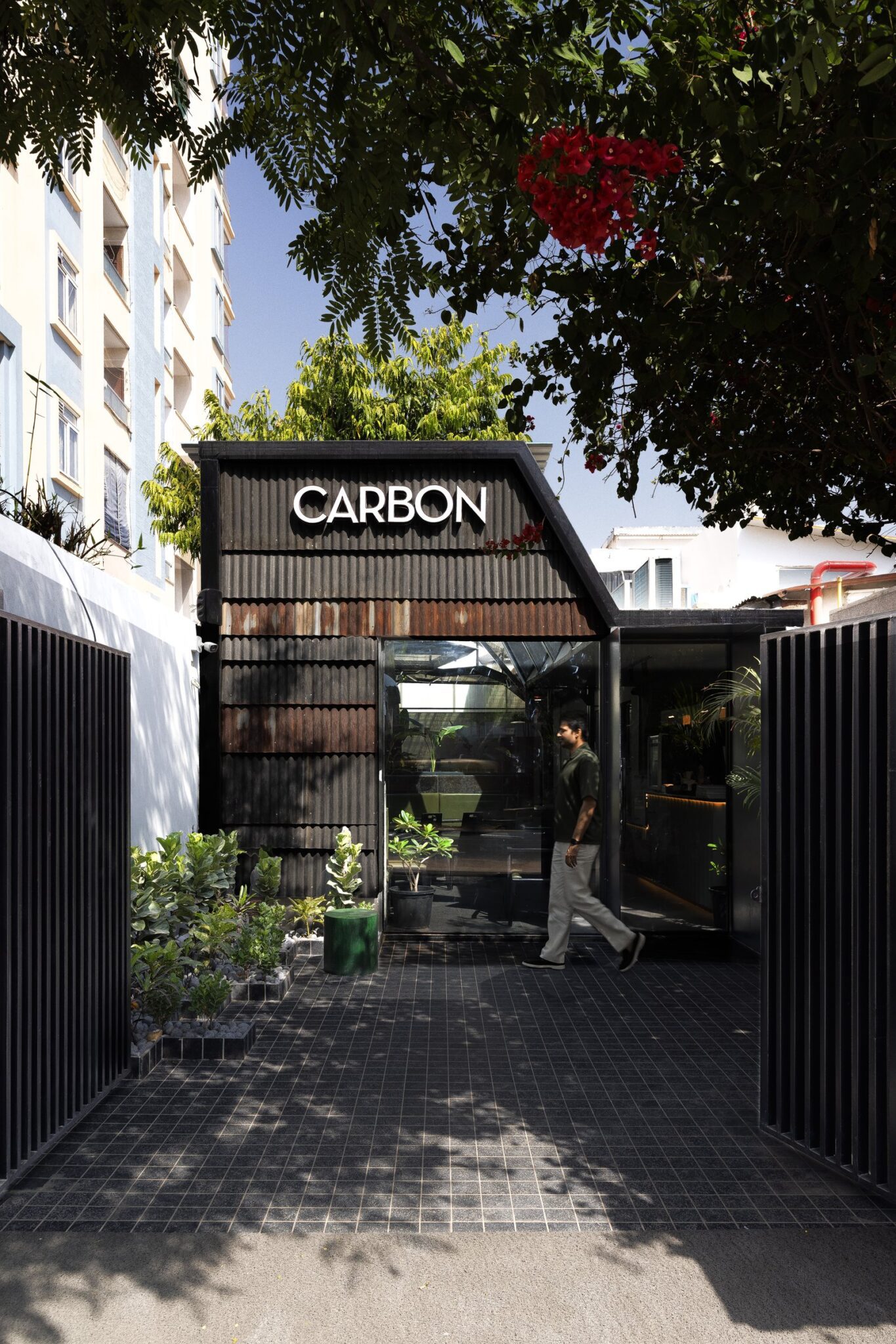 Carbon Coffee: A Monochromatic Café Rooted in Material Expression — interior design by Newness Architecture in Jaipur