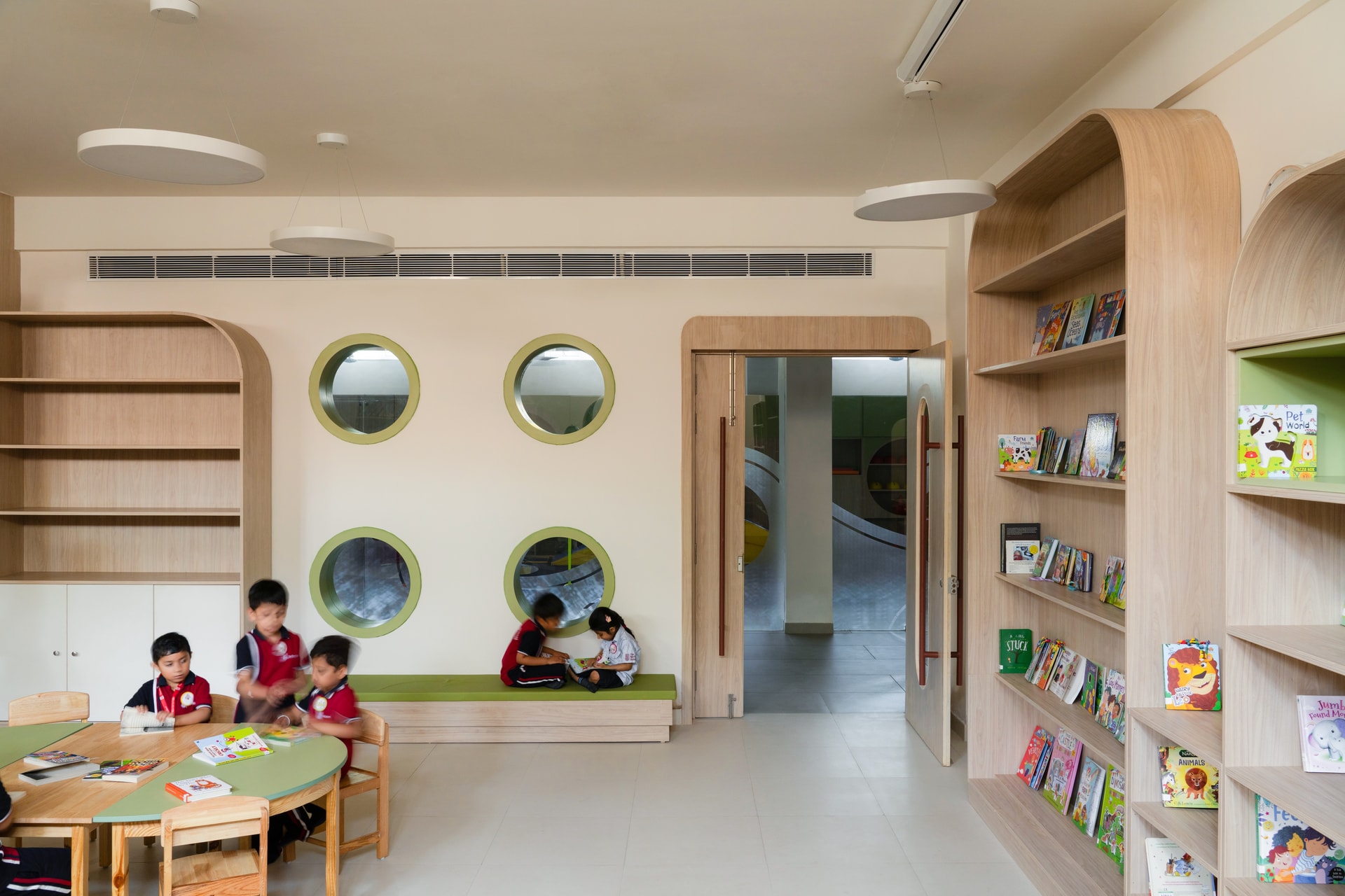 Interior view 2 — The Navriti School: A Campus Defined by Circles, Arches and Deep Red