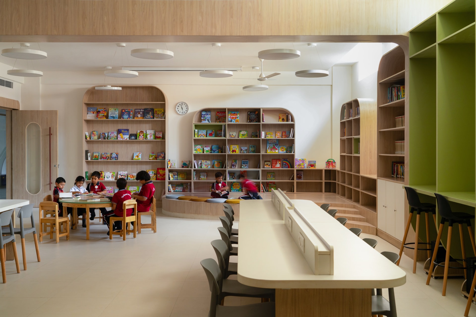 Interior view — The Navriti School: A Campus Defined by Circles, Arches and Deep Red