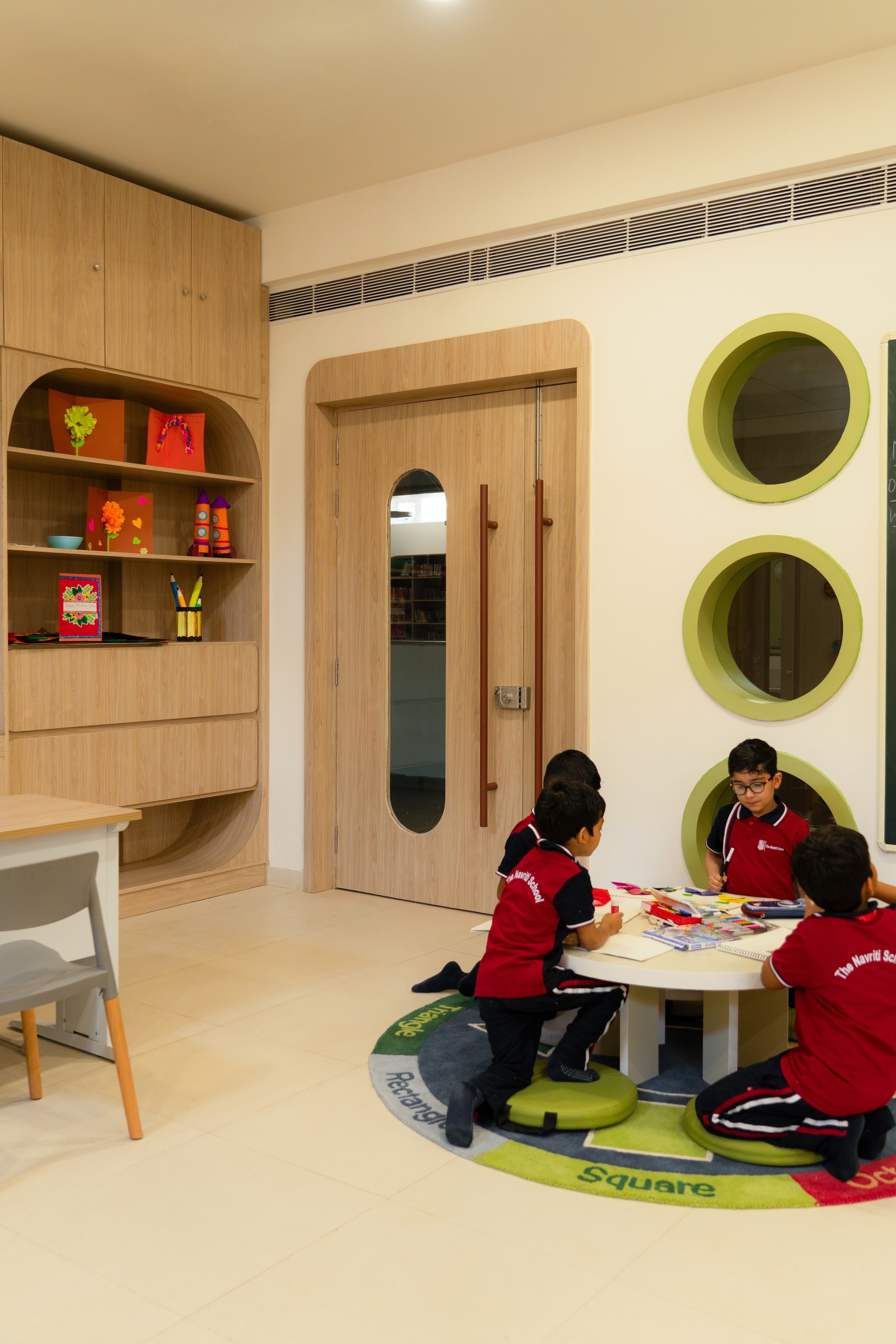 Interior view 5 — The Navriti School: A Campus Defined by Circles, Arches and Deep Red