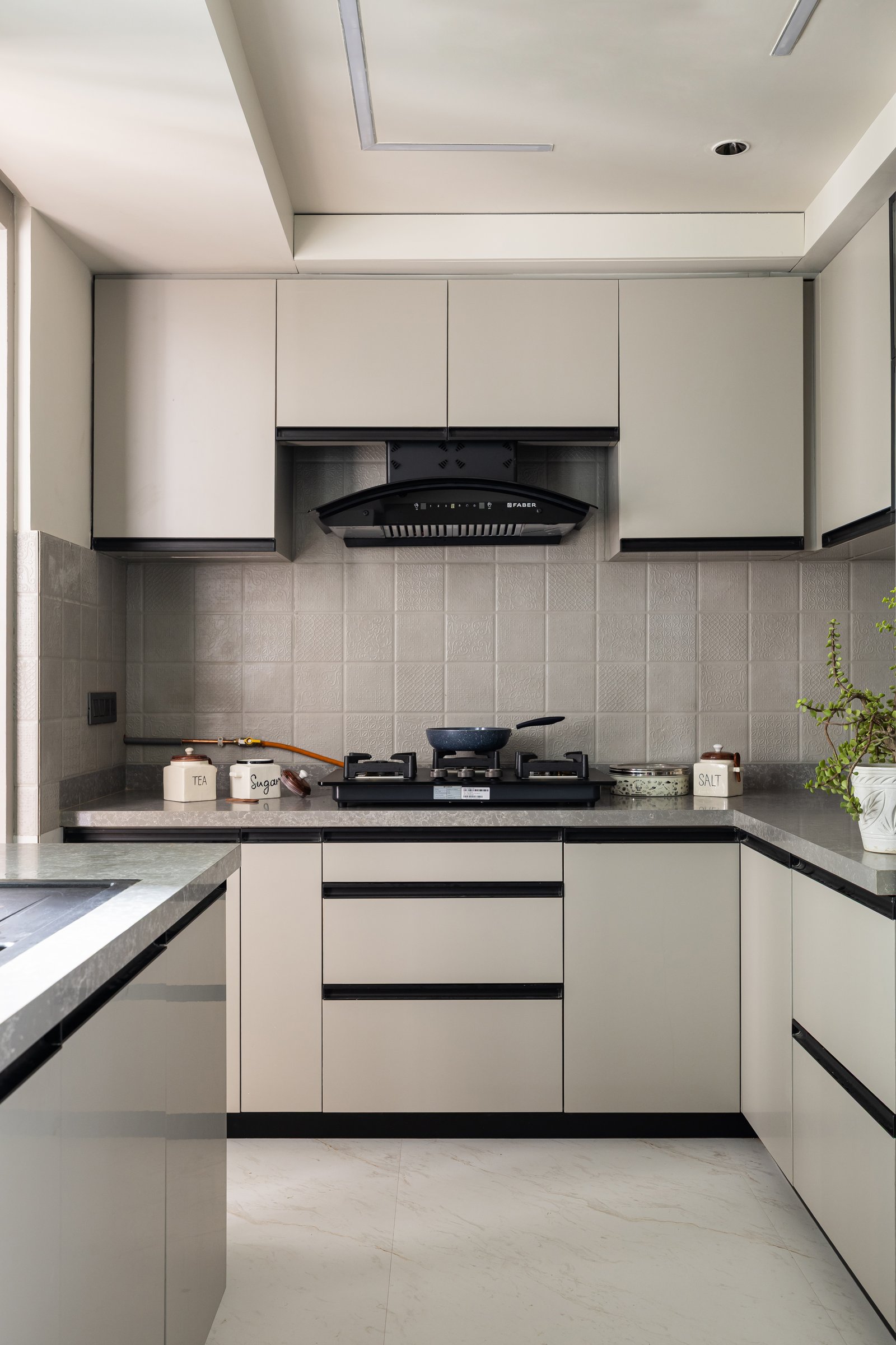 The kitchen adopts a functional register while sustaining the material ease of the wider home